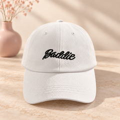 White cap with black embroidered Baddie script