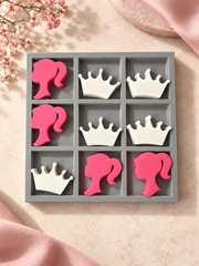 Gray tray tic-tac-toe set with pink girl silhouette pieces and white crown pieces