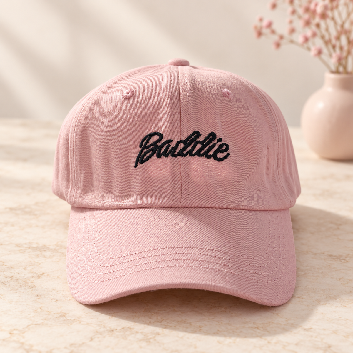 Pink cap with black embroidered Baddie script
