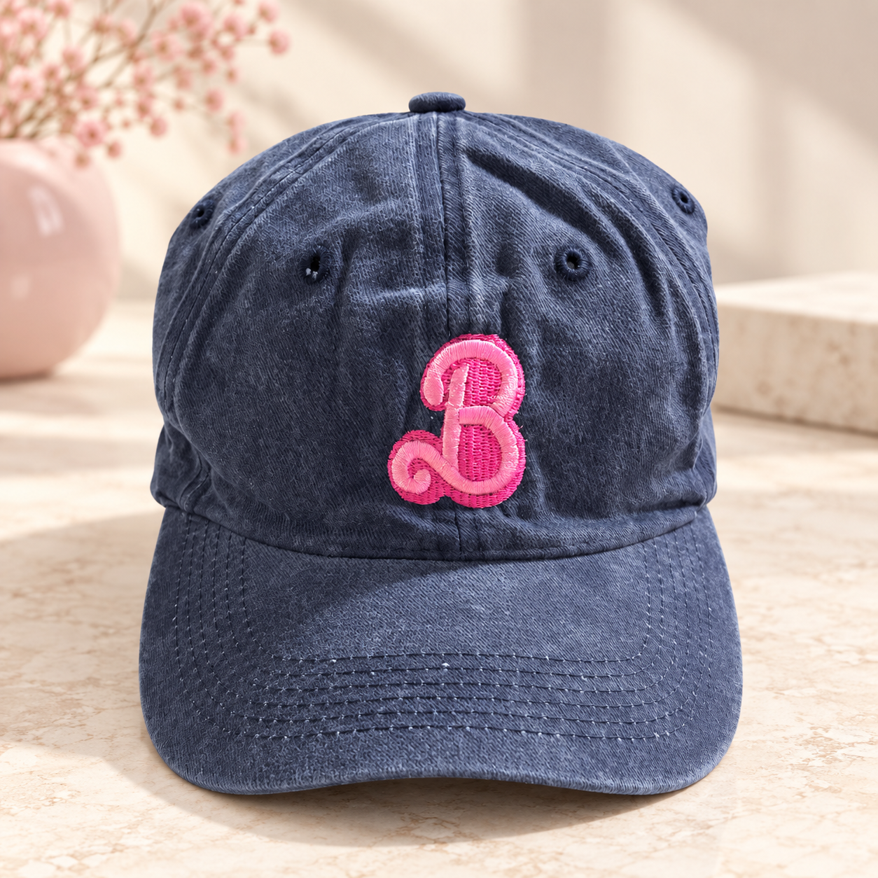 Denim washed cap with embroidered bright pink script B